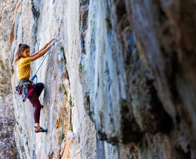 Girl,Climbs,A,Rock.,Rock,Climber,Girl.,Rock,Climbing,As